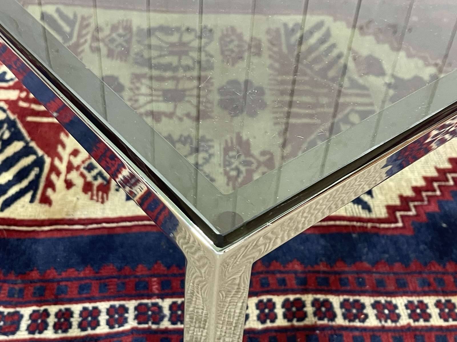 Chrome coffee table with a glass top from the 1980s.