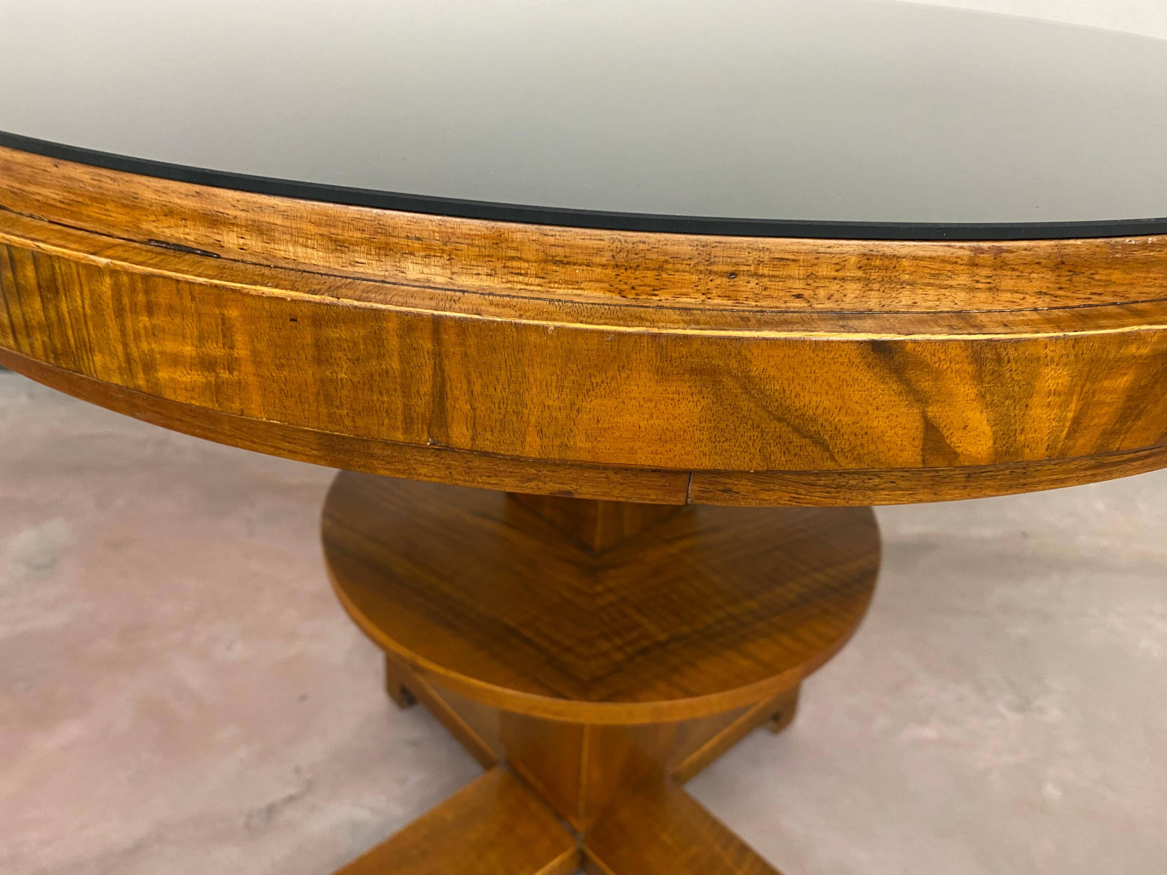 Art Deco game table with a black glass top.
