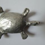 Small box in the shape of a silver metal turtle