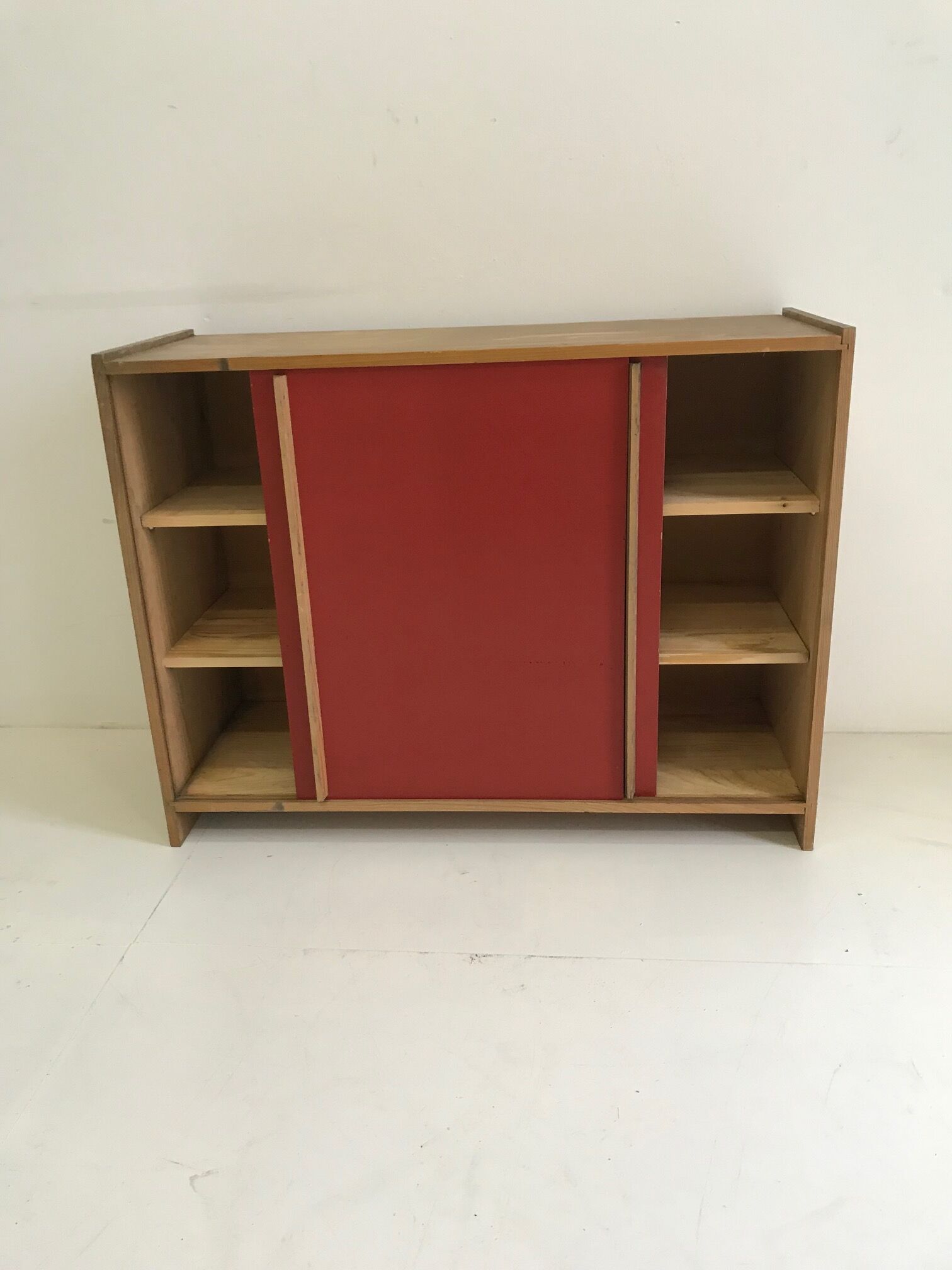 Vintage furniture with red sliding doors