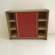 Vintage furniture with red sliding doors
