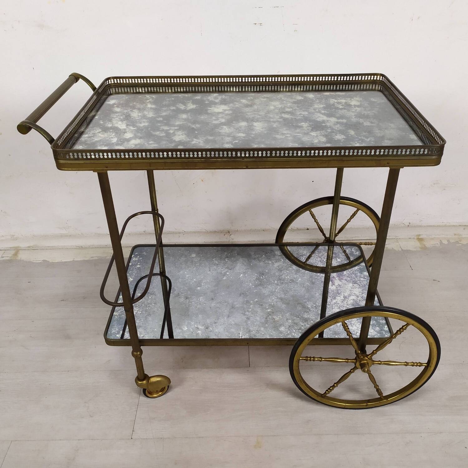 Brass and glass rolling trolley
