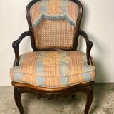Convertible armchairs Louis XV era in walnut moulded and cannes