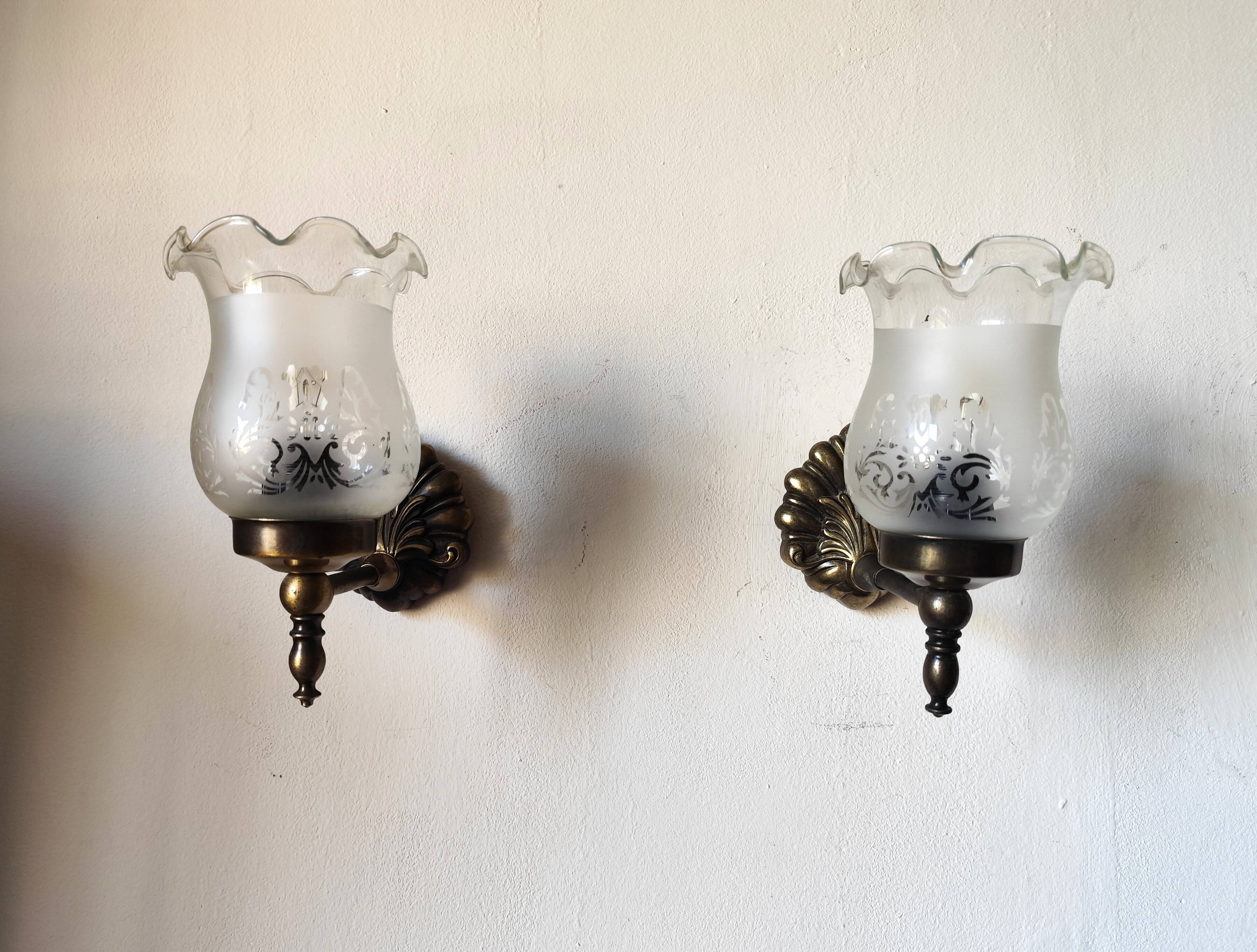 Pair of wall sconces in bronze with opaline glass tulips.