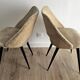 Pair of vintage barrel chairs in boucle fabric with brass splayed legs.
