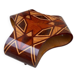 An Art Deco coffee table in multi-colored beech and rosewood.