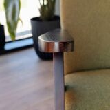 Vintage armchair in moss green bouclé design by H. Lis.