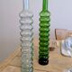 Pair of vintage ribbed blown glass bottles with cork stoppers.