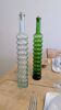 Pair of vintage ribbed blown glass bottles with cork stoppers.