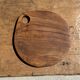 Average circular teak monoxyle chopping board with handle 26 x 18.