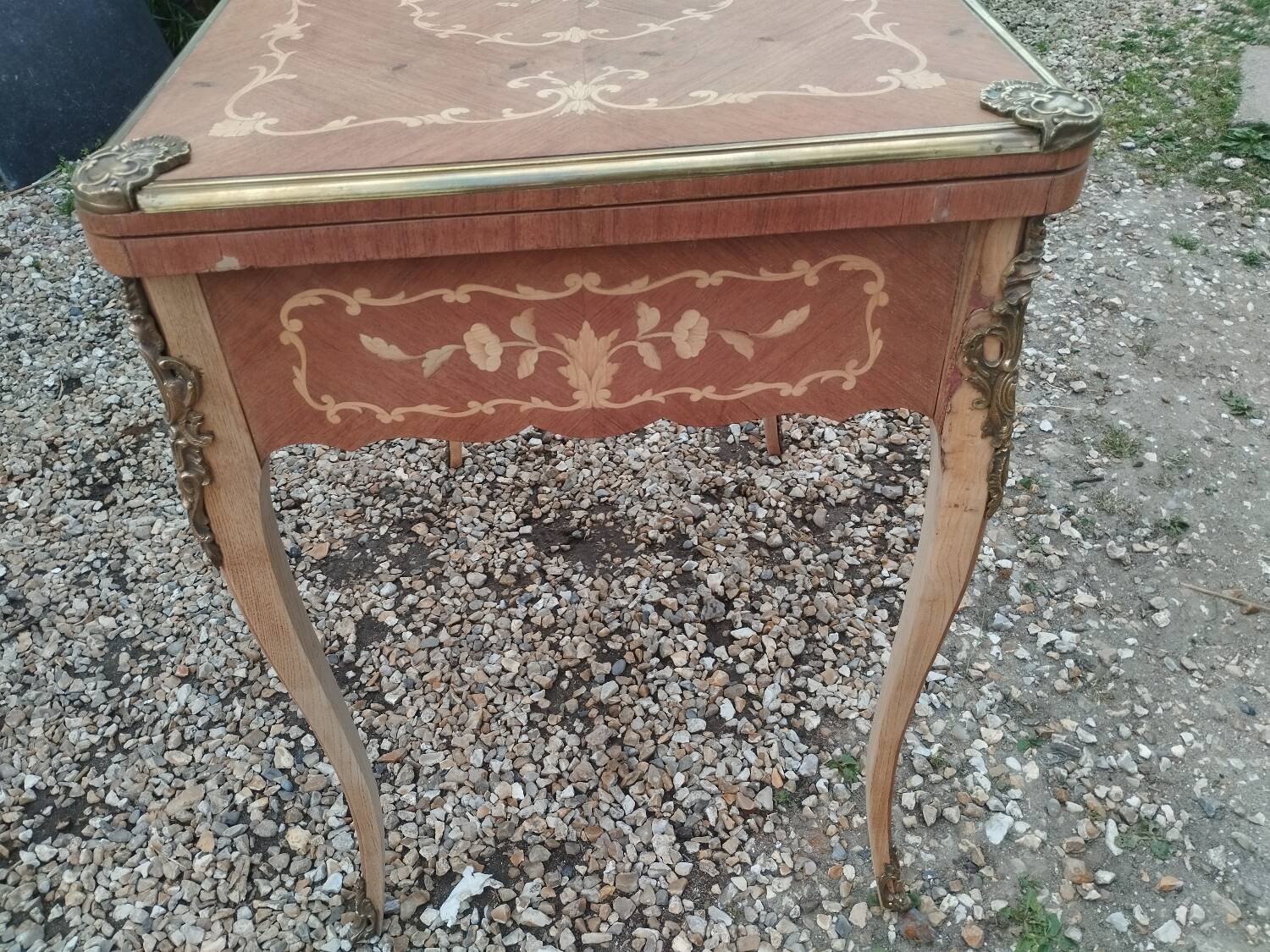 Antique game table in Louis XVI style with marquetry.