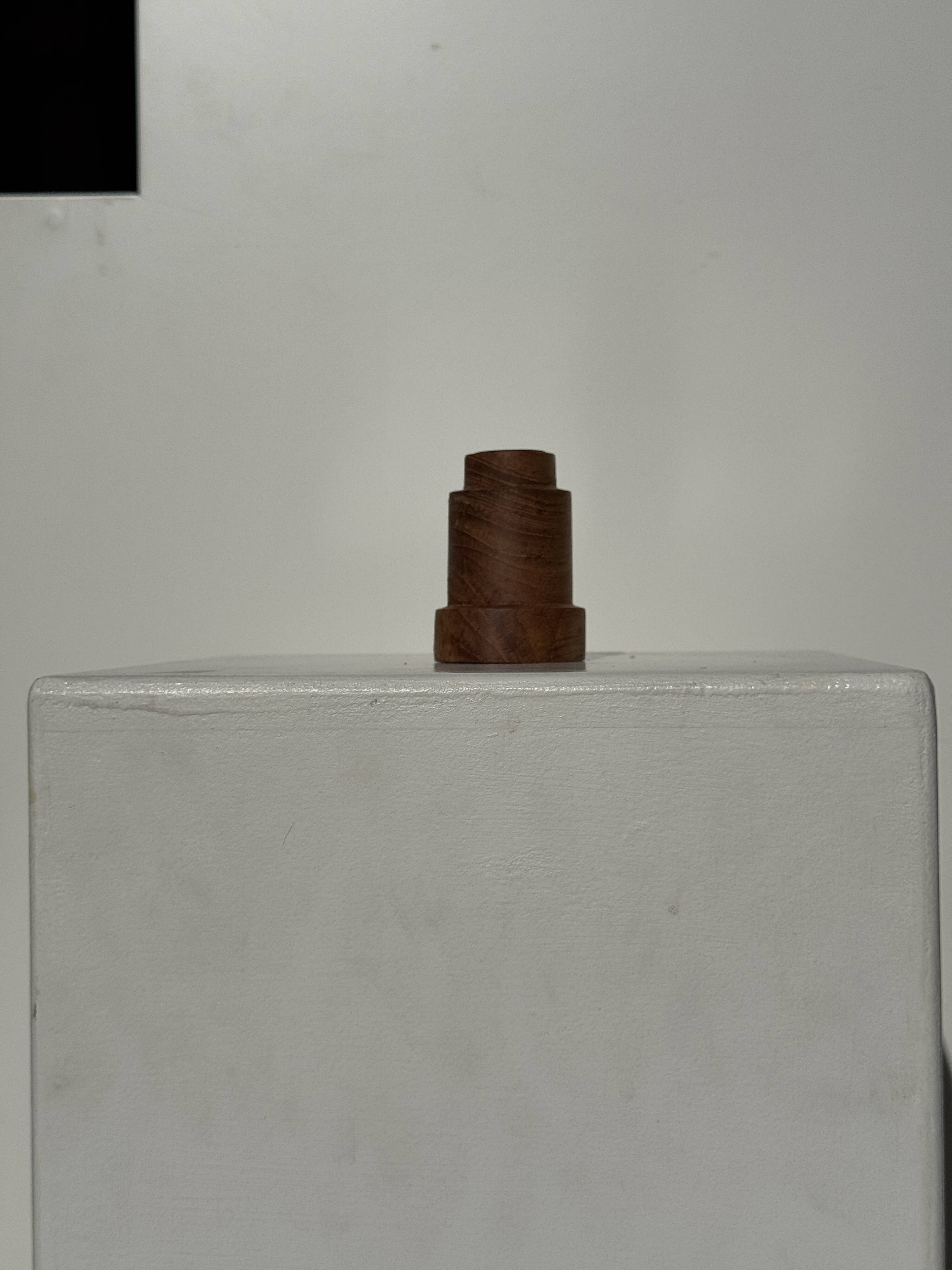 Circular teak monoxyle candlestick, pyramidal with a high central part H7 D5.