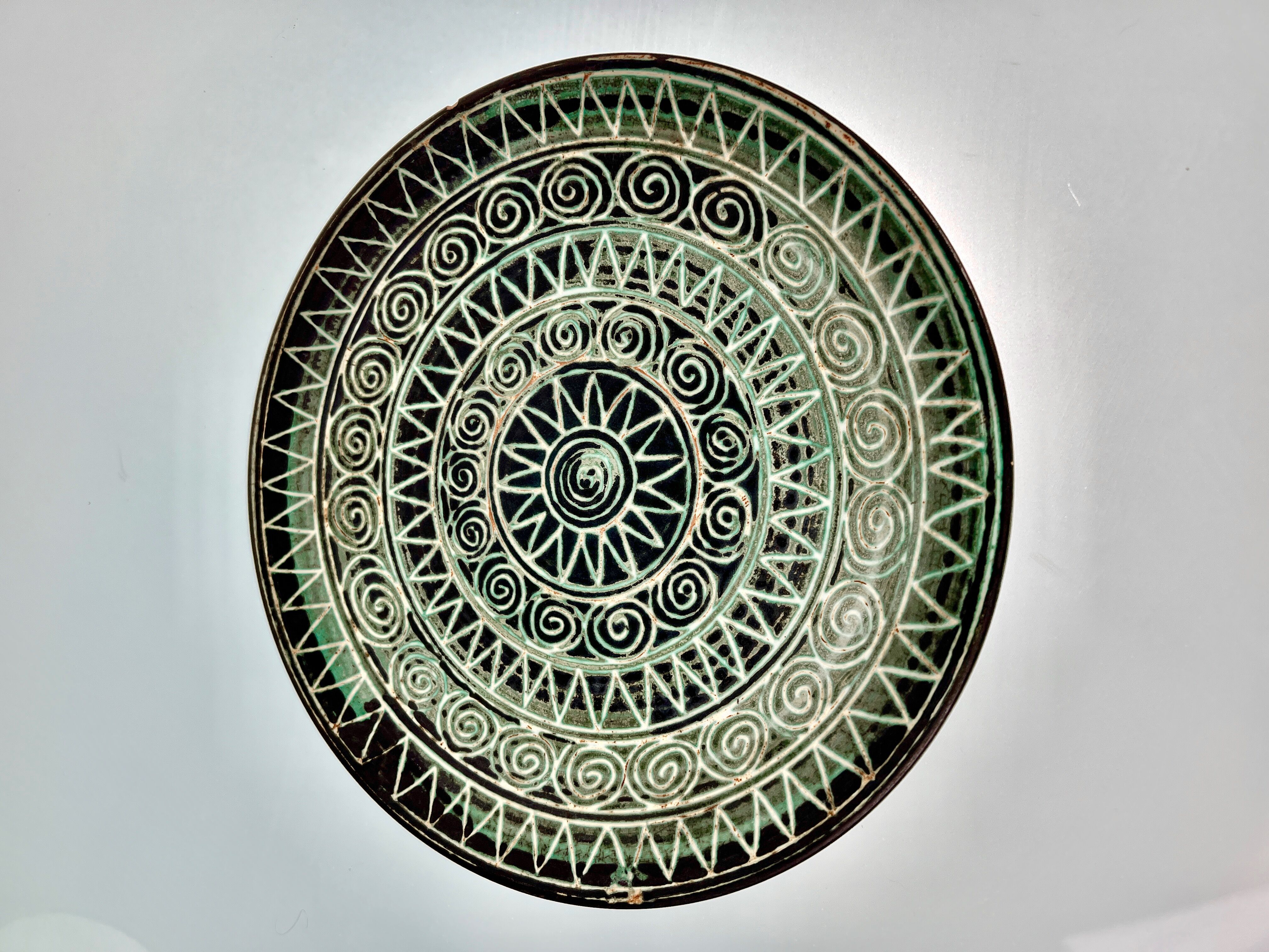 Flat ceramic plate by Robert Picault