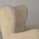 Fauteuil danois des années 1960, en véritable peau de mouton "Canberra", retapissé.