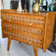 Vintage wooden and rattan chest of drawers with tapered legs.