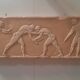 Bas-relief in the antique style featuring athletes.
