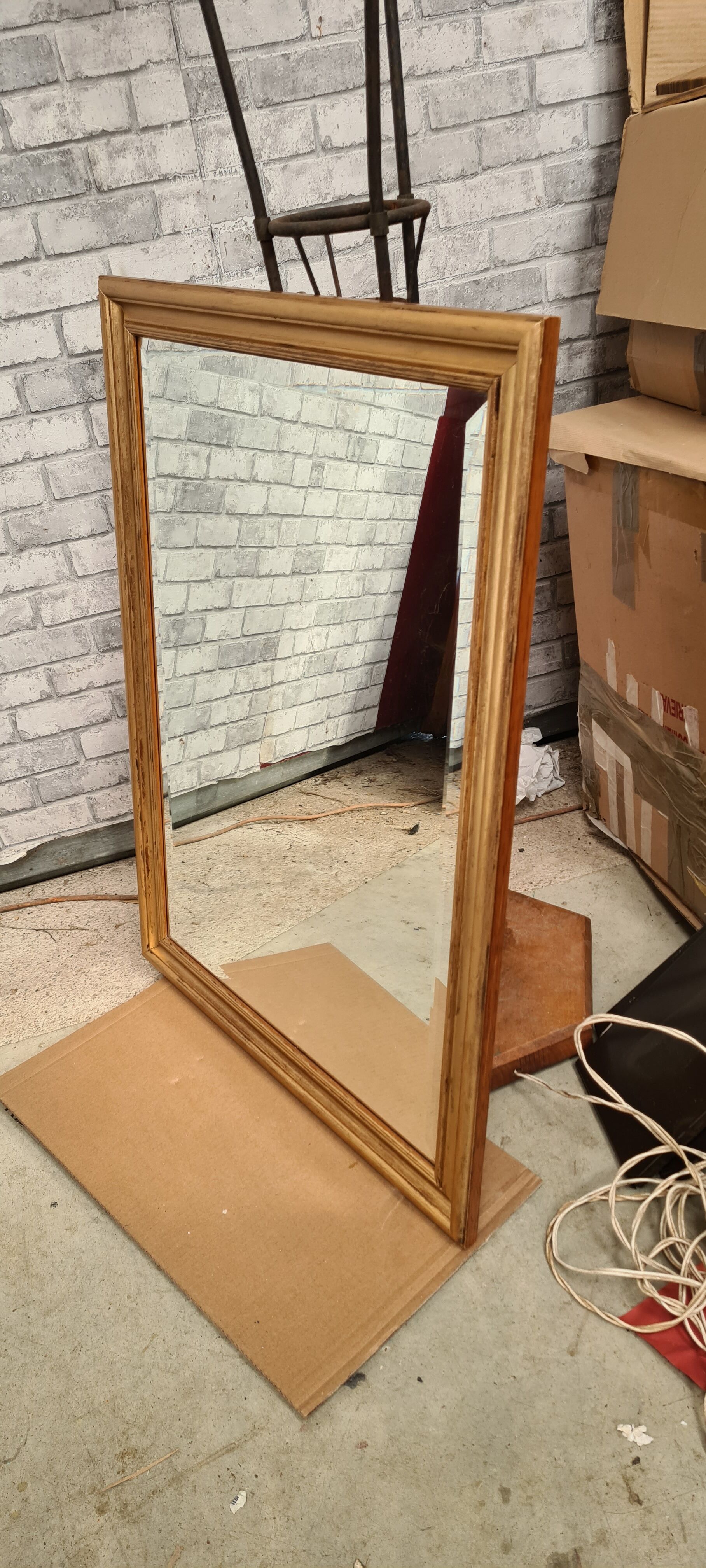 Gilded mirror on wood, 89x59