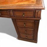 Oak desk with 9 drawers and leather writing pad.