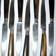 Set of 12 antique table knives from 1900 with horn handles and forged steel blades, Paris, 24.5 cm long.