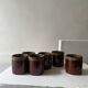 Service of 6 coffee cups in handcrafted glazed ceramic, amber brown, 1970.