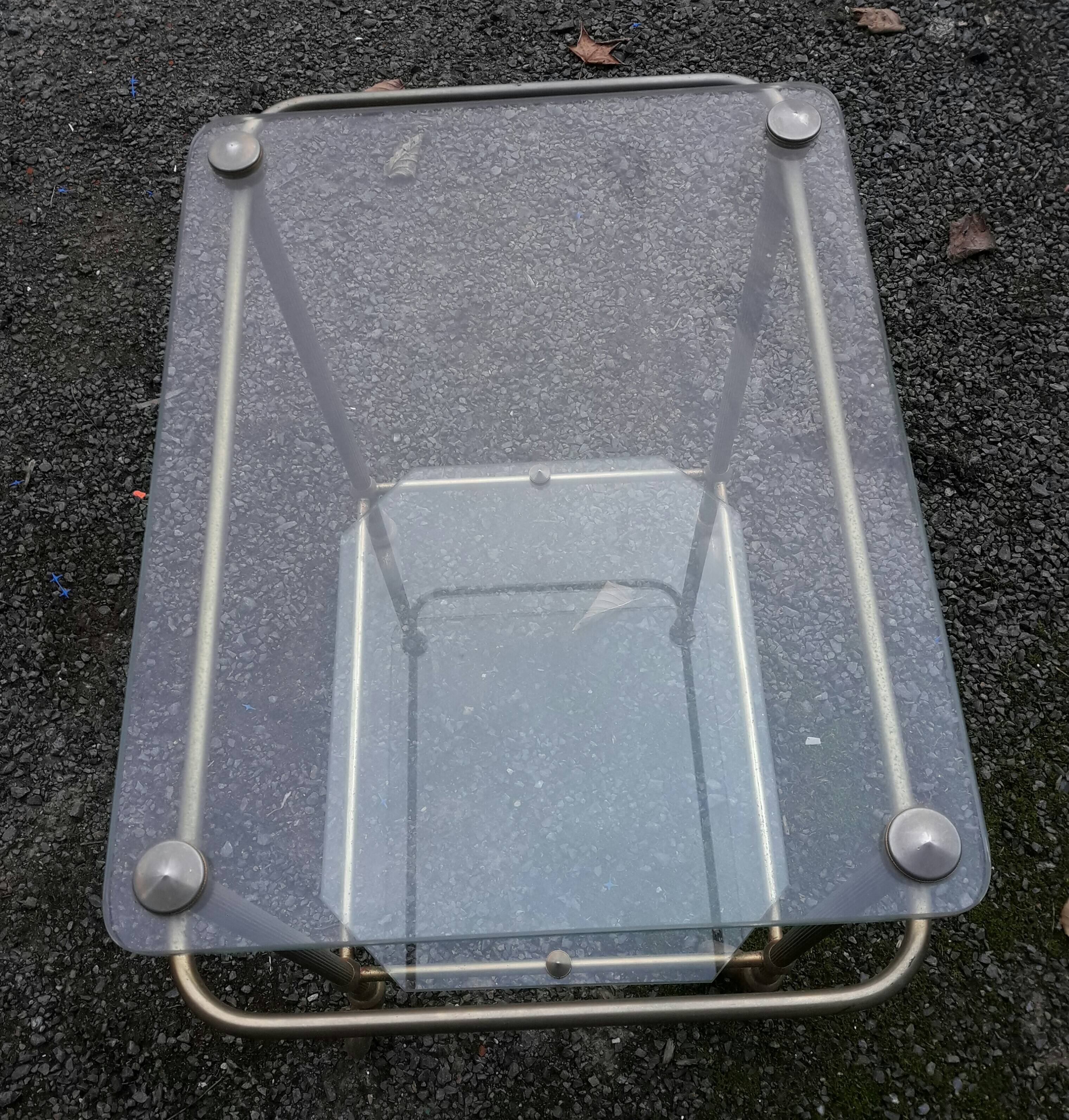 Small rolling table in glass and gold metal