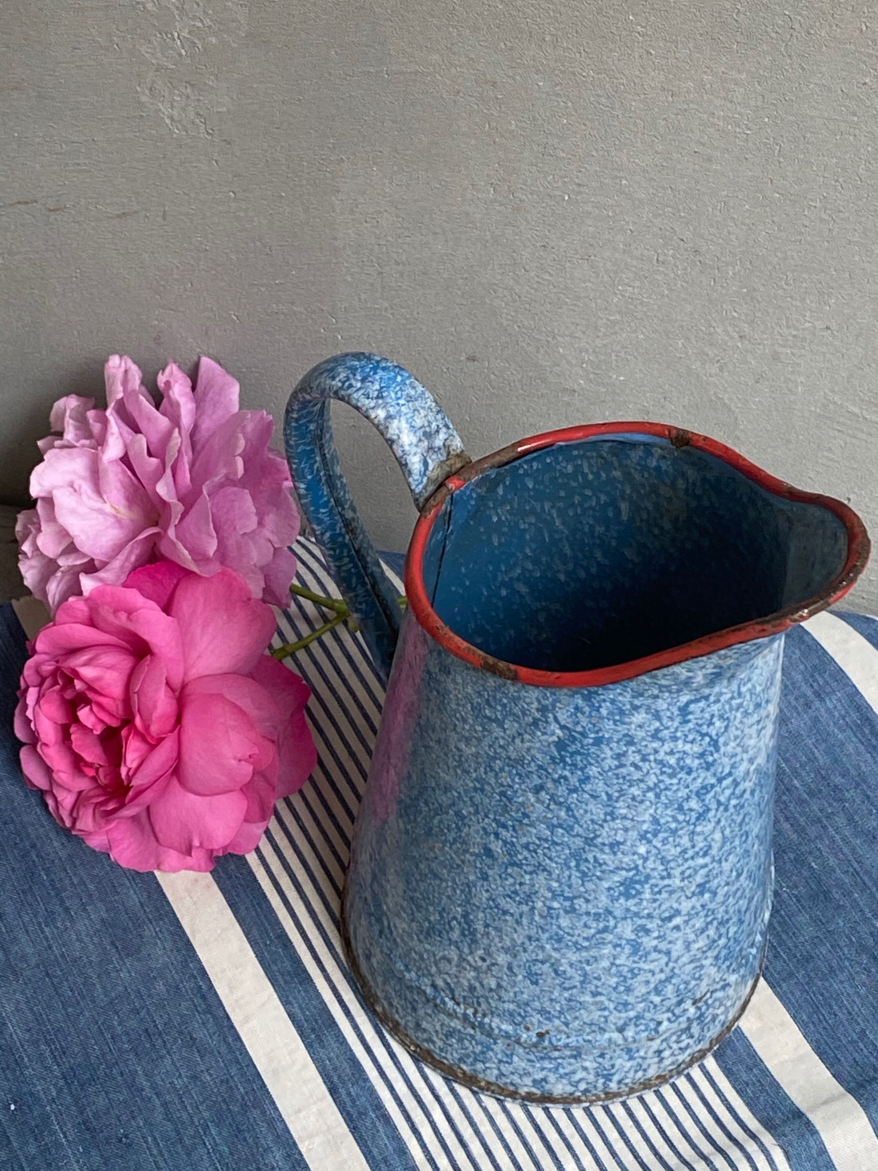 Old enamelled pitcher