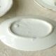 Tableware set in earthenware with floral decoration.