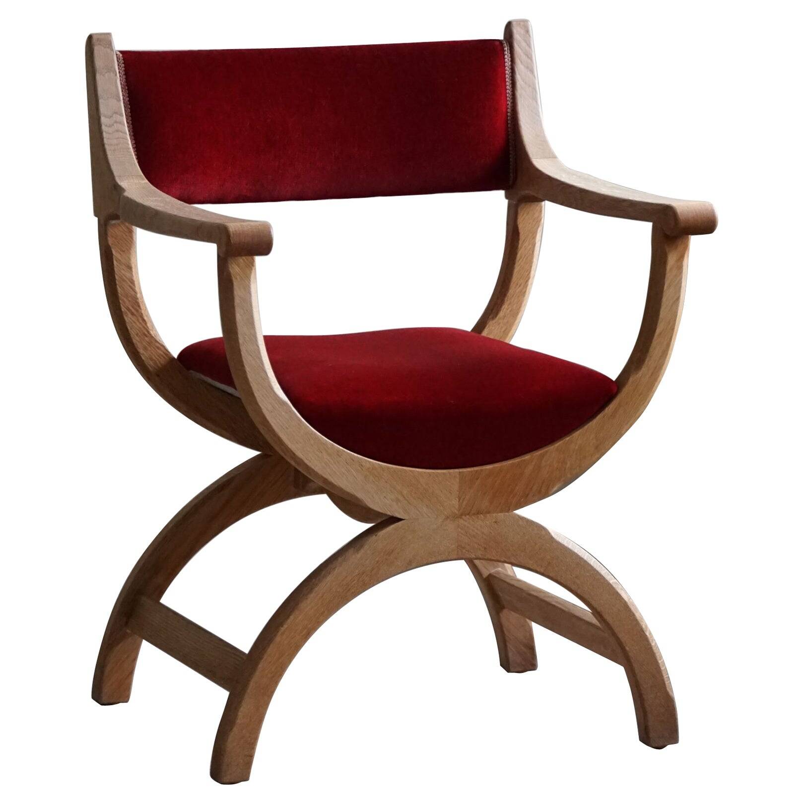 Henning Kjærnulf, armchair in oak and velvet, model "Kurul", mid-century, 1960s.
