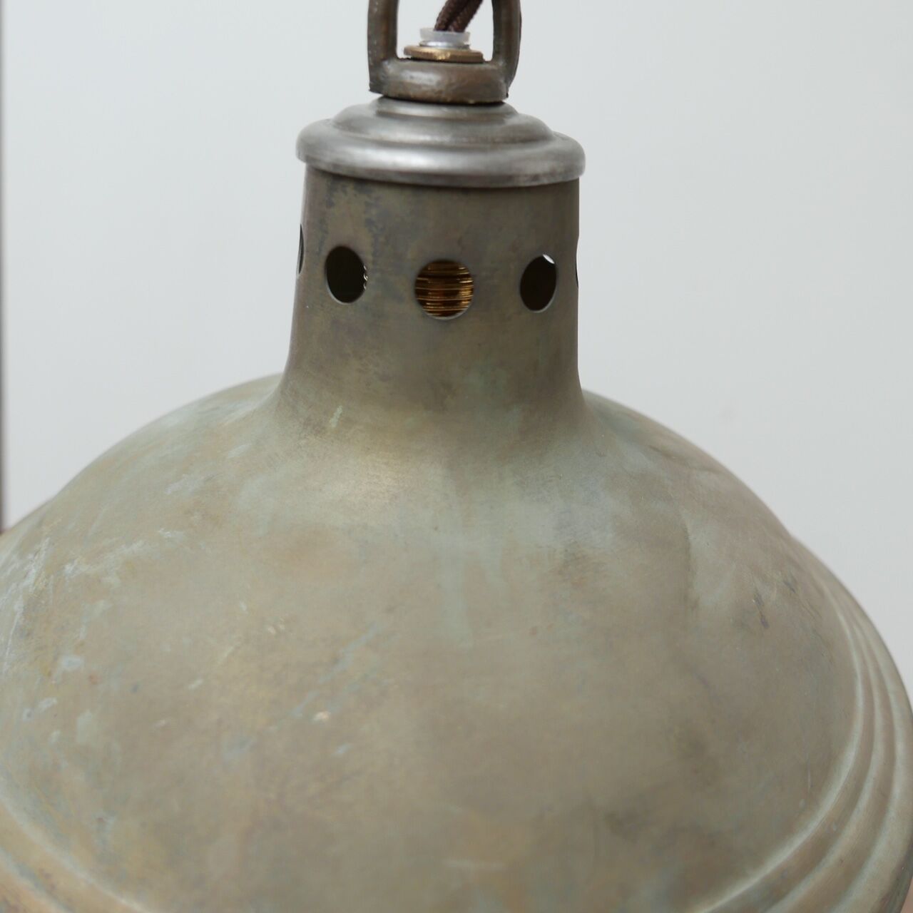 Patinated metal and glass Holophane pendant light