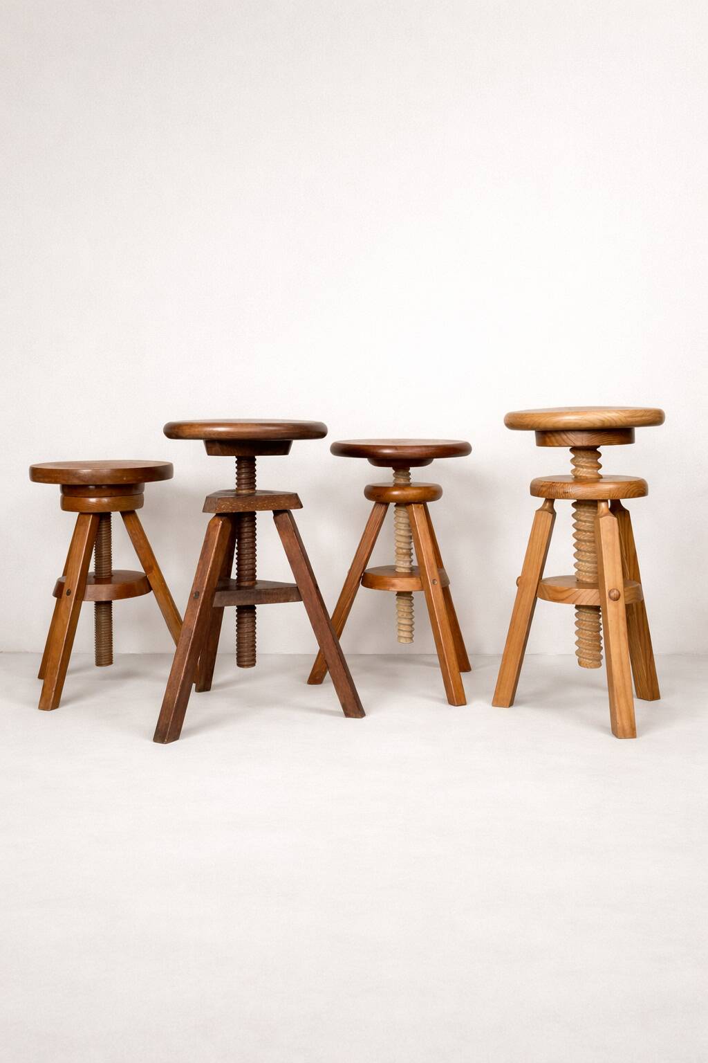 Set of 4 wooden screw stools.