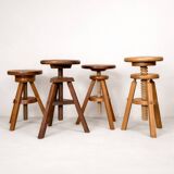 Set of 4 wooden screw stools.