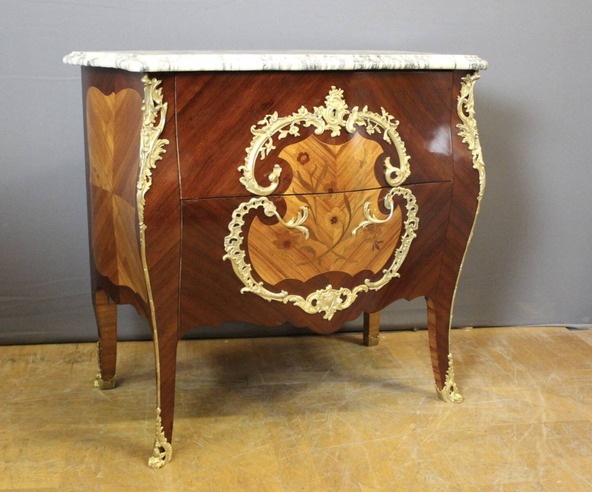 Louis XV style commode in marquetry around 1900