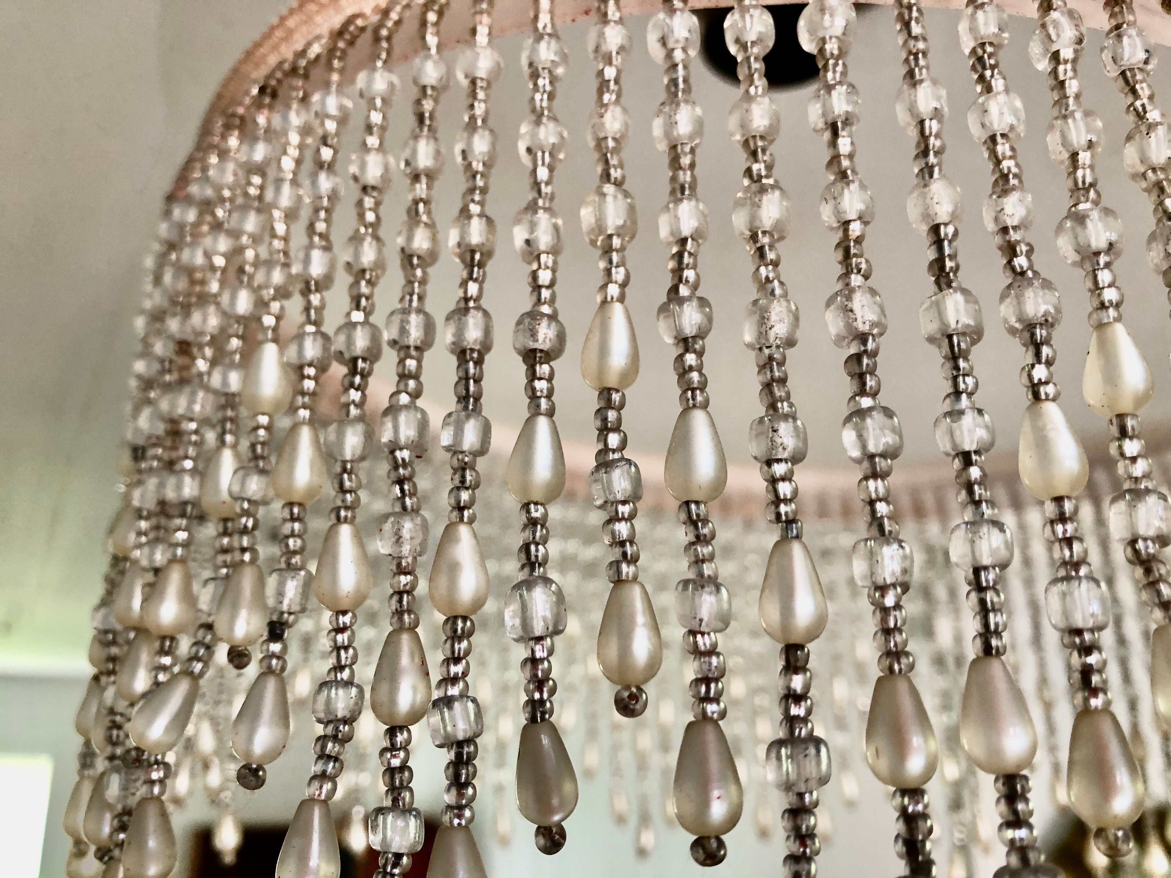 Pink half-shell suspension with pearl fringe