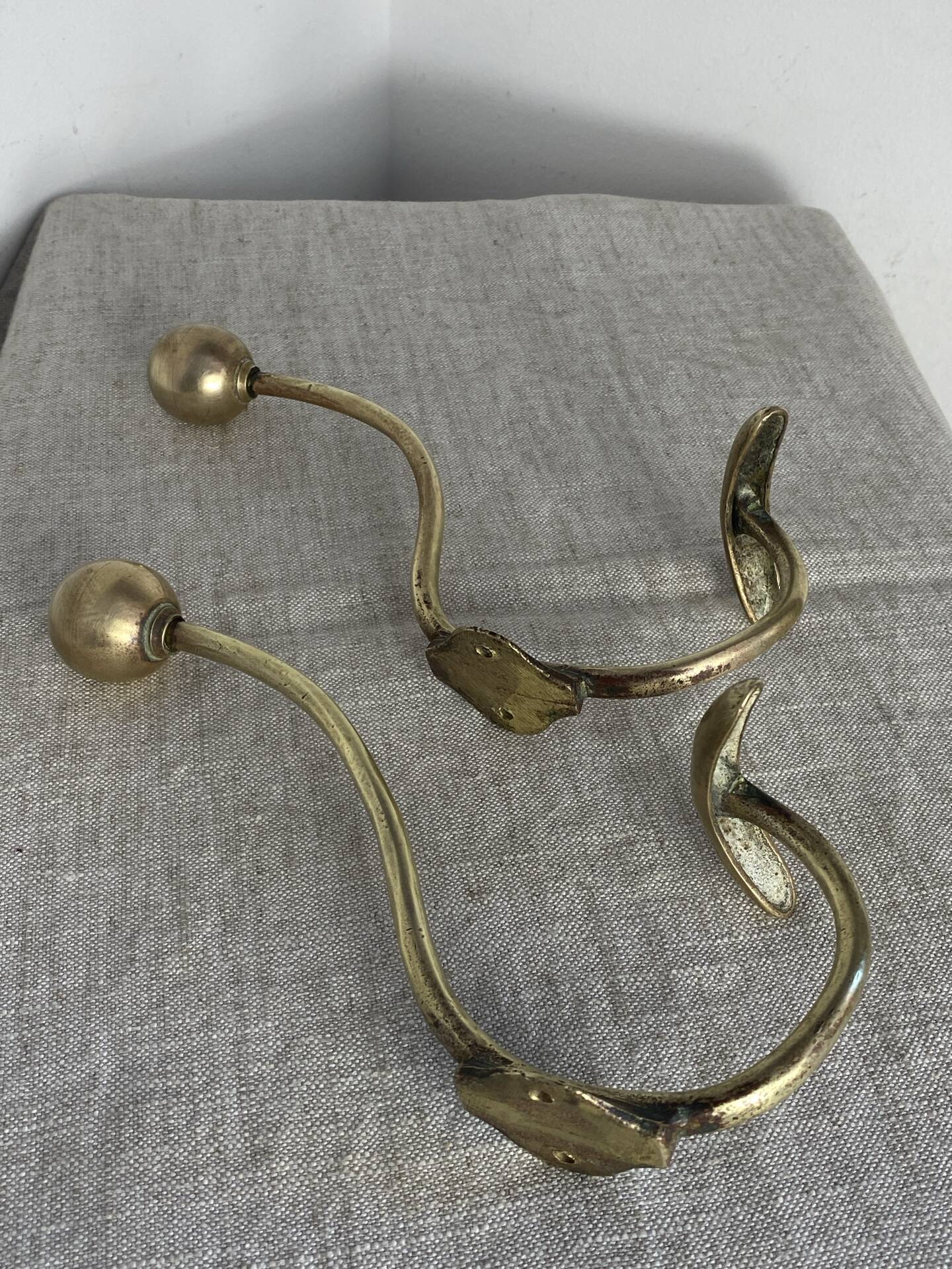 Pair of ball and hook coat hooks in brass