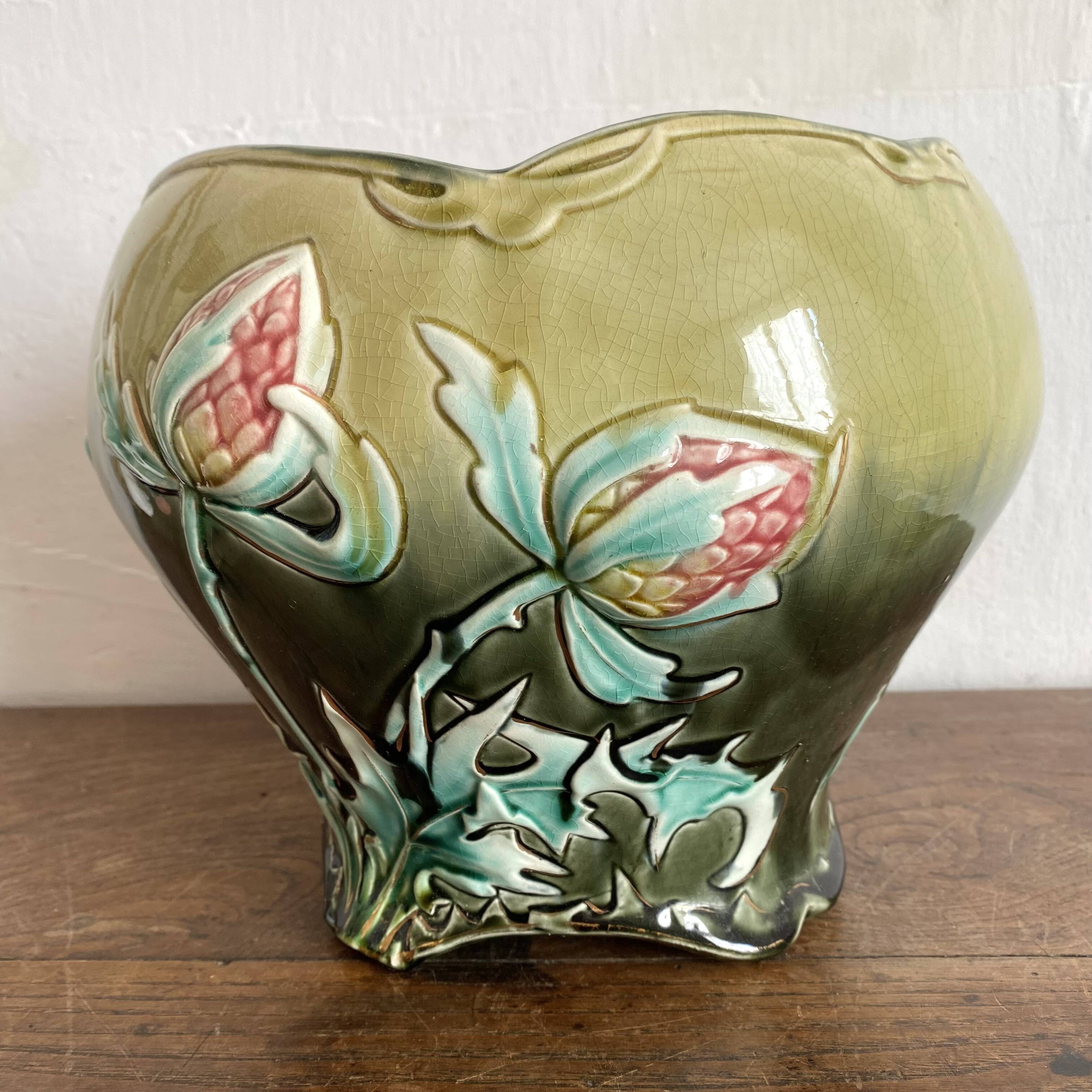 Large earthenware cache-pot in Art Nouveau style, decorated with thistles.