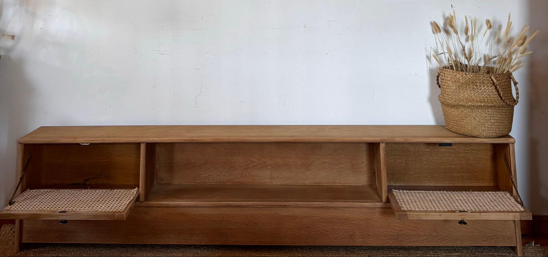 TV sideboard in raw oak and cane.