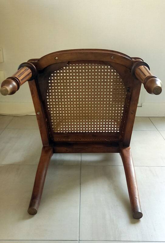 Solid oak art deco chair with cane and fabric.