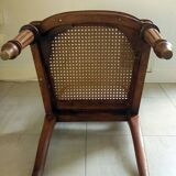 Solid oak art deco chair with cane and fabric.