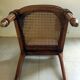 Solid oak art deco chair with cane and fabric.