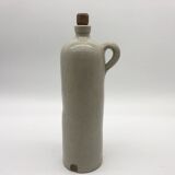 Old hot water bottle in glazed stoneware, gray color.