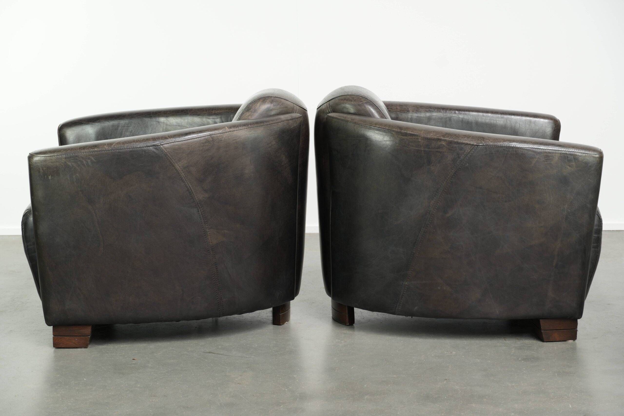 Ensemble vintage de 2 fauteuils en cuir de vachette au design Aviateur.