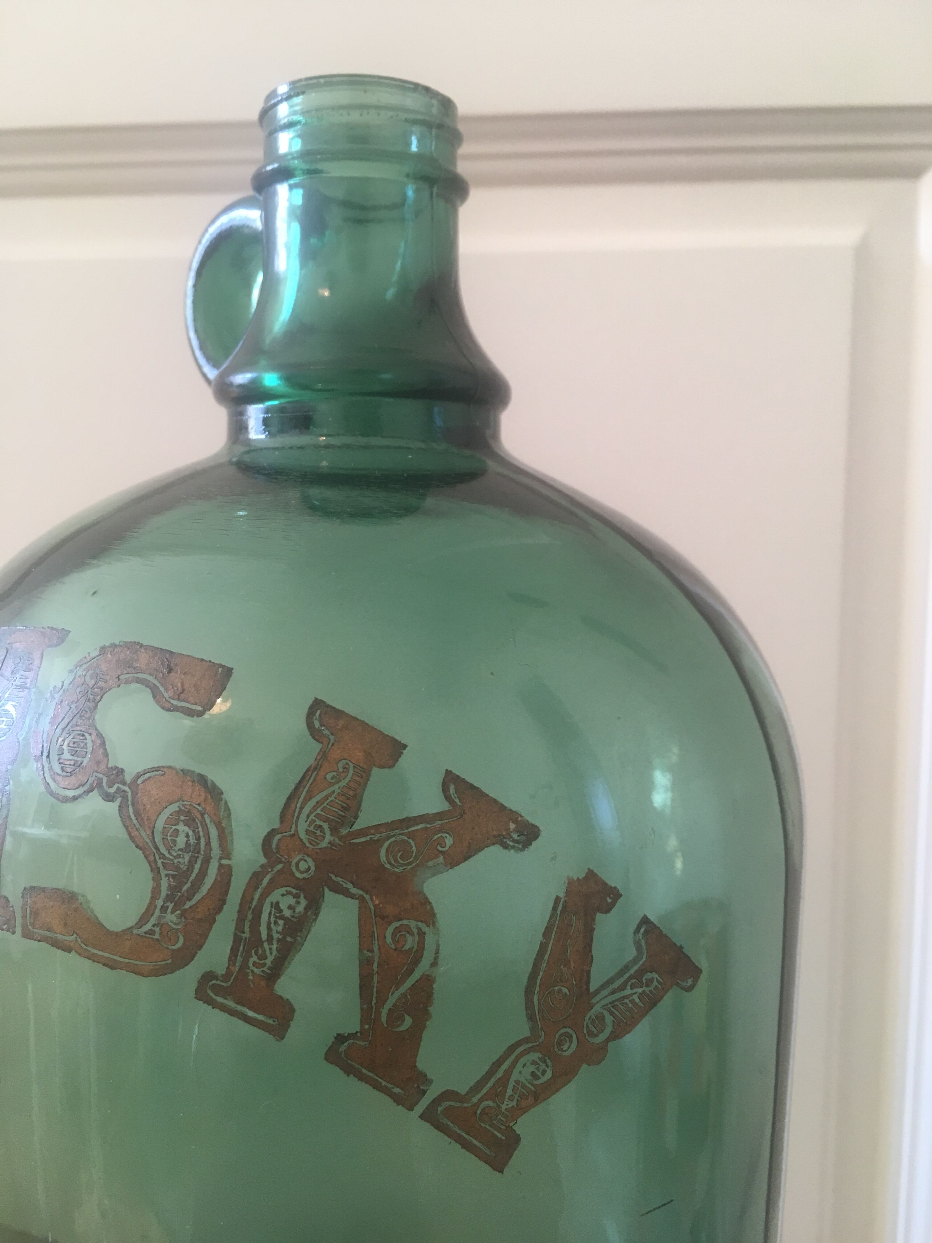 Green glass whiskey bottle