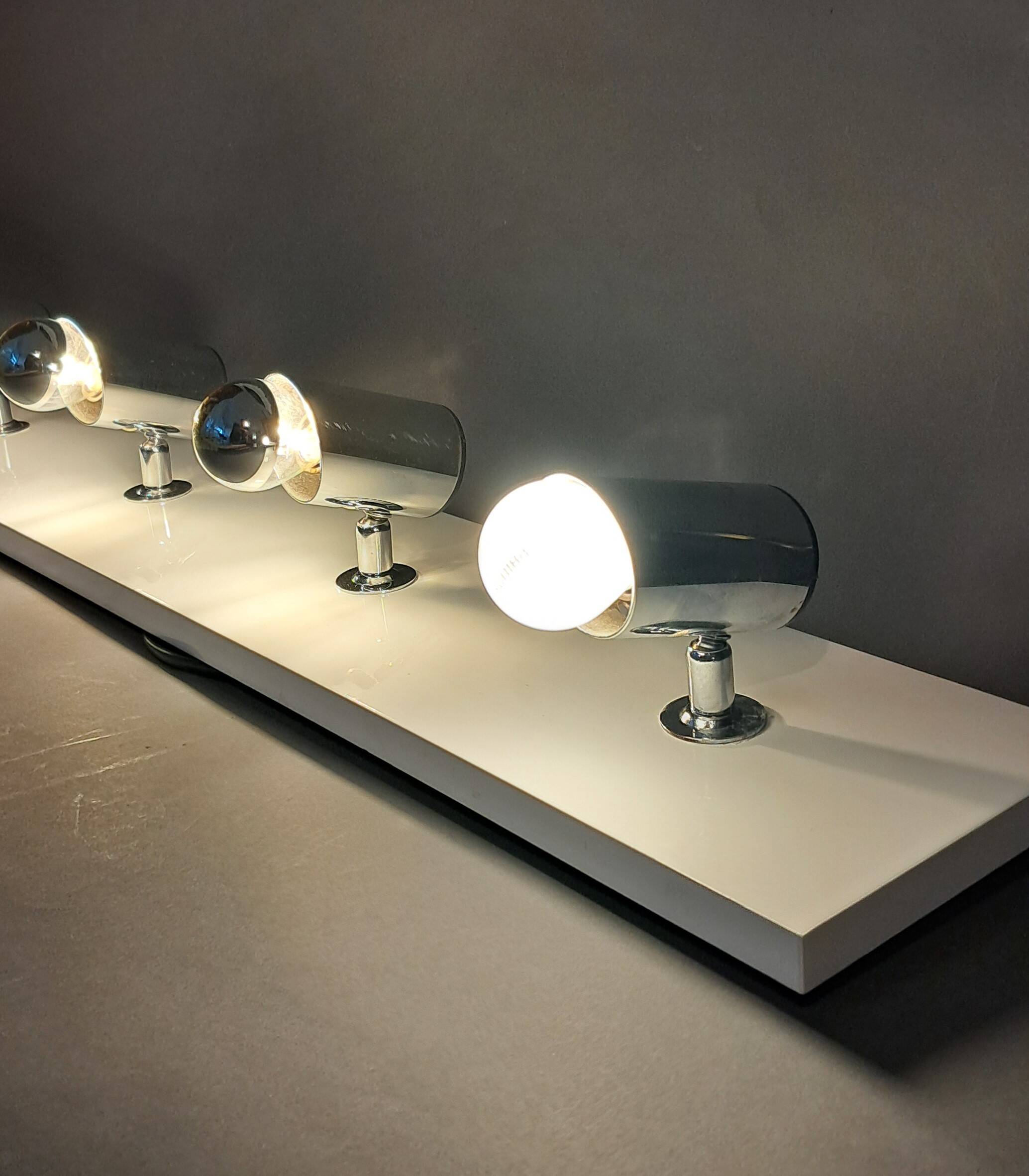 Targetti Sankey spotlights on white lacquered wooden ramp