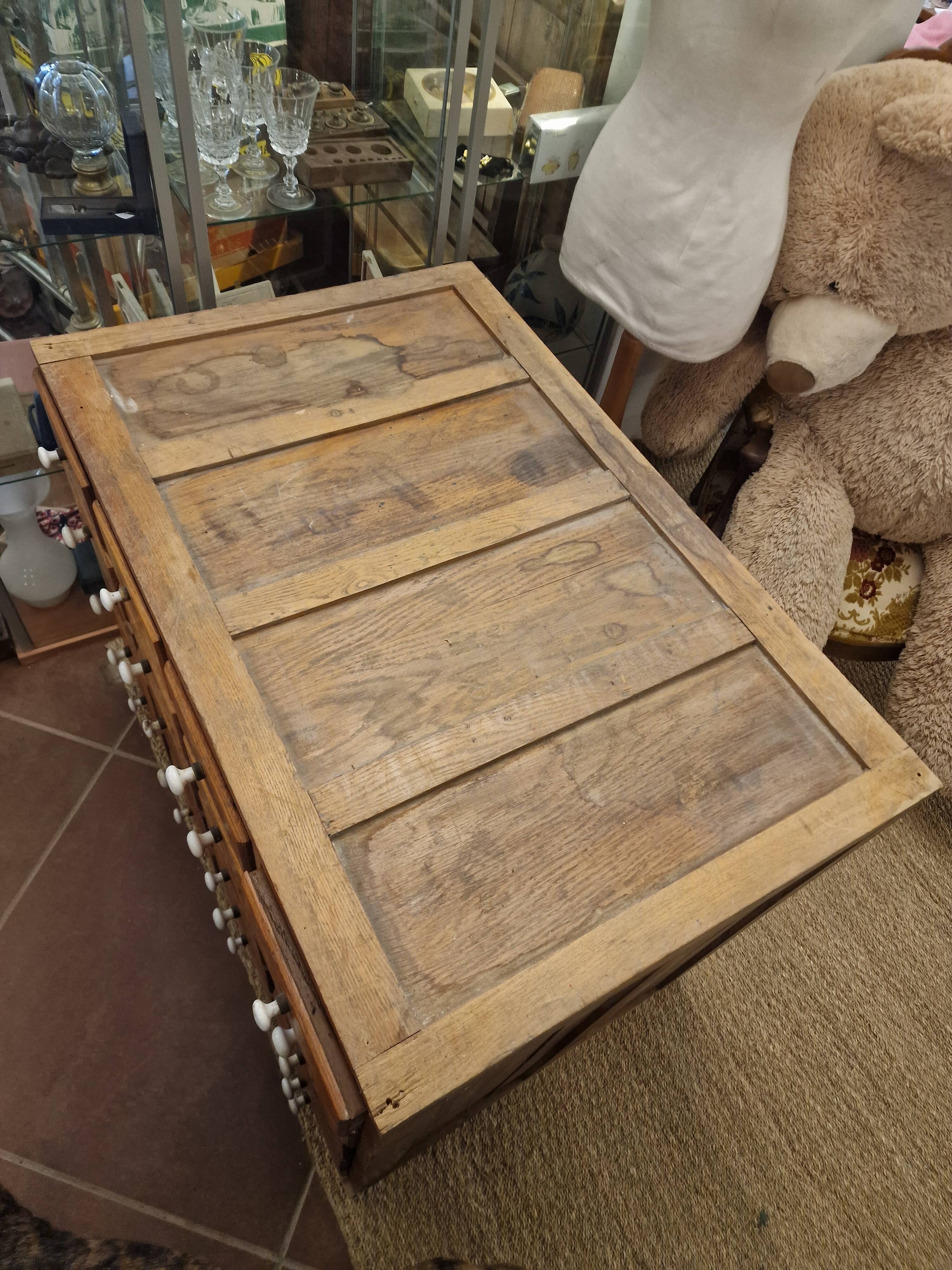 Antique craft cabinet with solid oak drawers and porcelain handles