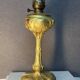 Beautiful and old oil lamp in gilded bronze, attributed to Georges Leleu