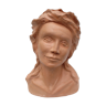 Ancient bust of a young woman in terracotta