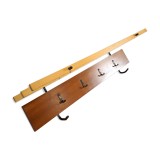 Vintage wall coat rack with black hooks and light wood