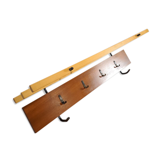 Vintage wall coat rack with black hooks and light wood