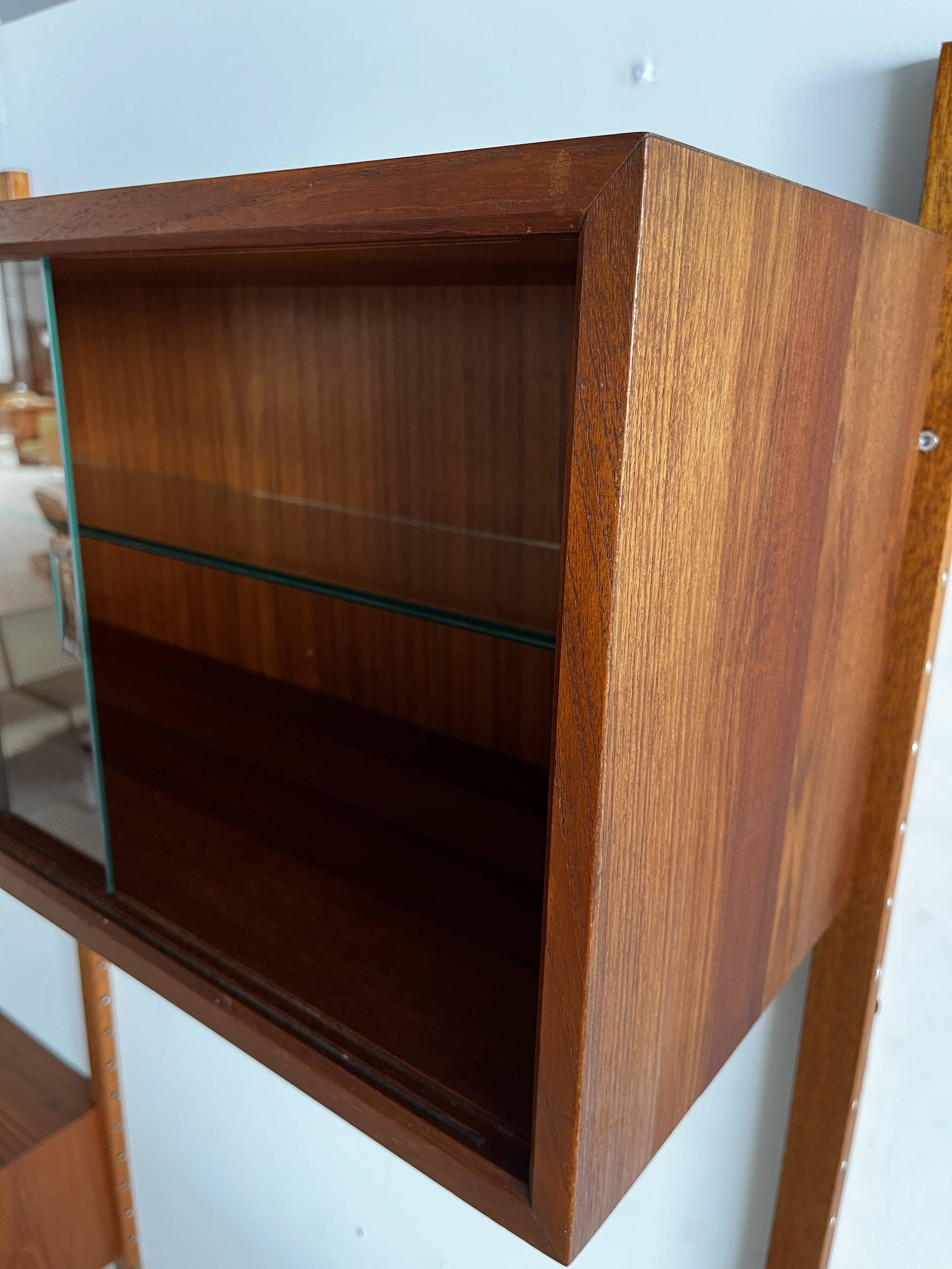 A wall unit with 4 compartments by Poul Cadovius, Denmark, 1960s.
