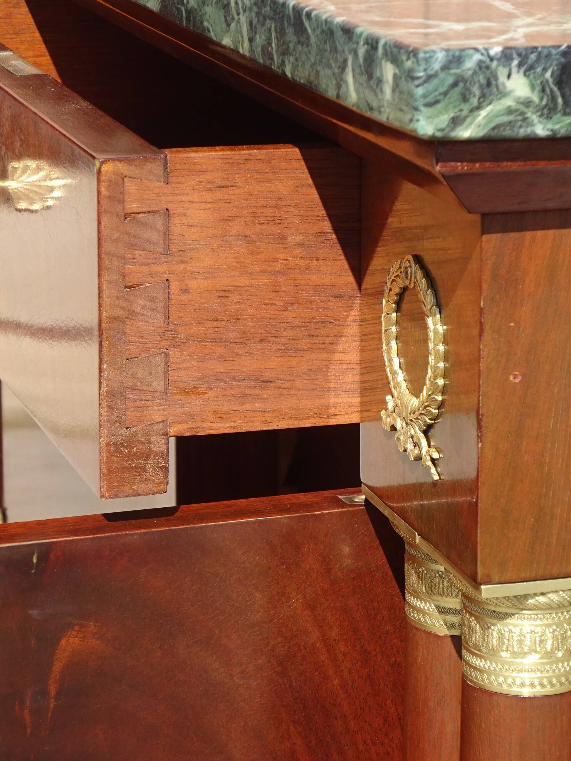 Flamed mahogany enfilade with sea green marble in Empire style.